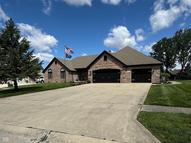 28 Patriot Ct, Greenfield, IN 46140 - french provincial home with an attached garage, a front lawn, concrete driveway, and roof with shingles