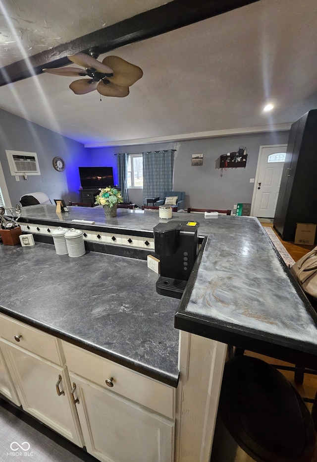 402 W Black Foot Trl, Greensburg, IN 47240 - kitchen featuring ceiling fan, dark countertops, white cabinetry, and open floor plan