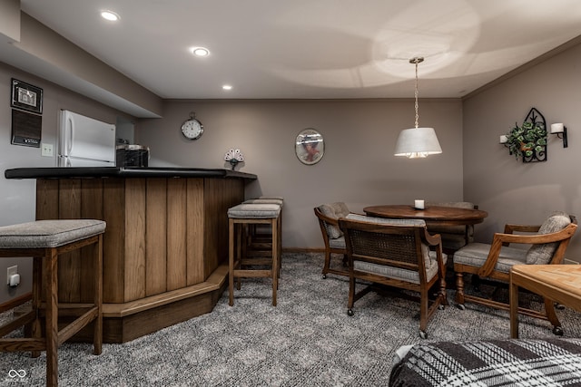 8905 Washington Blvd W Drive, Indianapolis, IN 46240 - carpeted dining space with a dry bar, recessed lighting, and baseboards