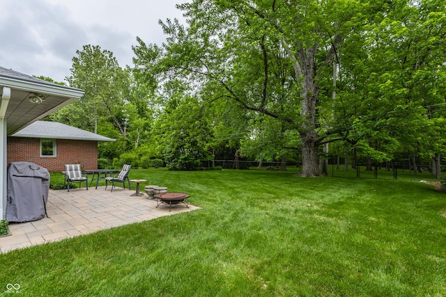 8905 Washington Blvd W Drive, Indianapolis, IN 46240 - view of yard with a patio and an outdoor fire pit