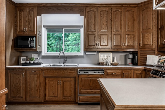 8905 Washington Blvd W Drive, Indianapolis, IN 46240 - kitchen featuring a sink, paneled dishwasher, black microwave, light wood-style floors, and light countertops
