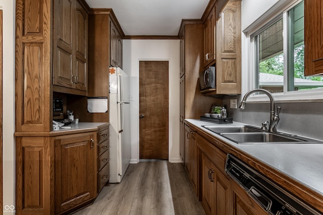8905 Washington Blvd W Drive, Indianapolis, IN 46240 - kitchen featuring a sink, freestanding refrigerator, dishwasher, wood finished floors, and black microwave