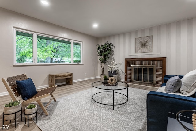 8905 Washington Blvd W Drive, Indianapolis, IN 46240 - living room featuring wood finished floors, baseboards, a brick fireplace, and recessed lighting