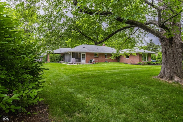 8905 Washington Blvd W Drive, Indianapolis, IN 46240 - view of green lawn with a sunroom