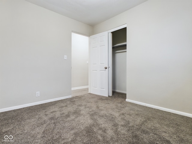 1325 Northcrest Dr, Anderson, IN 46012 - unfurnished bedroom with carpet flooring, baseboards, and a closet