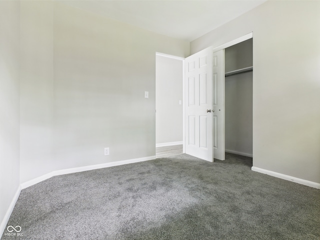 1325 Northcrest Dr, Anderson, IN 46012 - unfurnished bedroom featuring carpet, baseboards, and a closet