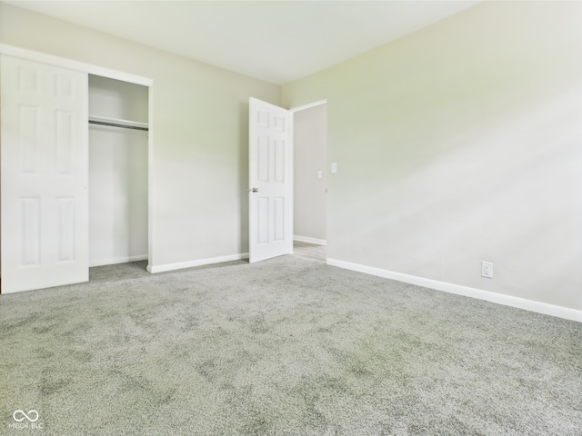 1325 Northcrest Dr, Anderson, IN 46012 - unfurnished bedroom featuring carpet floors, baseboards, and a closet