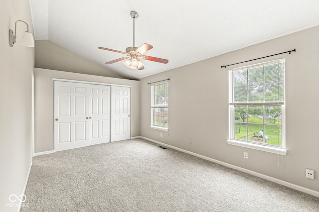 11072 Lake Run Dr, Fishers, IN 46038 - unfurnished bedroom with vaulted ceiling, carpet floors, a closet, and baseboards