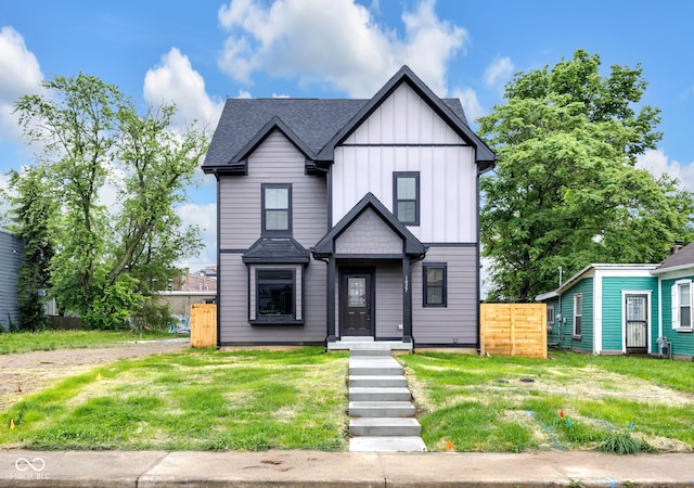 1027 Hosbrook St, Indianapolis, IN 46203 - view of front facade with board and batten siding and roof with shingles