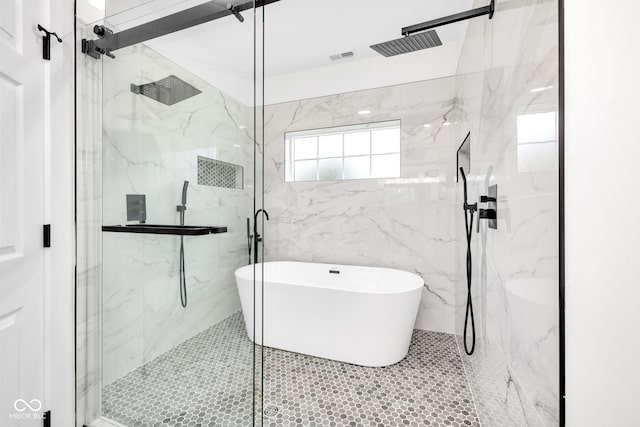 1027 Hosbrook St, Indianapolis, IN 46203 - bathroom with a marble finish shower, a freestanding tub, and tile walls
