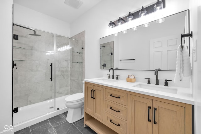 1027 Hosbrook St, Indianapolis, IN 46203 - bathroom with double vanity, a shower stall, toilet, and marble look tiles