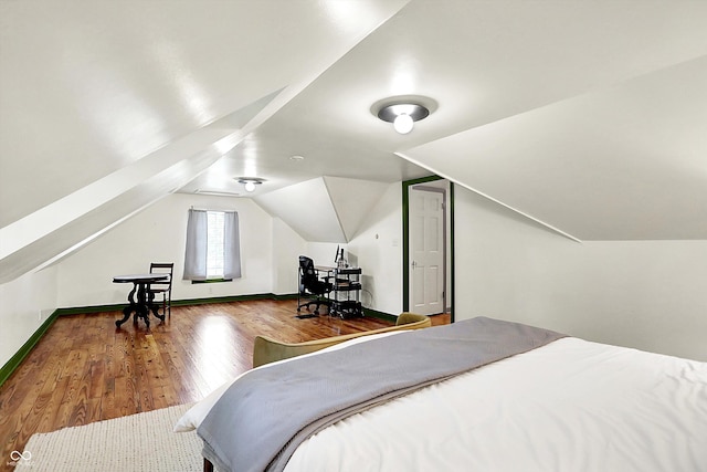 1725 W 53rd St, Indianapolis, IN 46228 - bedroom with wood finished floors, lofted ceiling, and baseboards