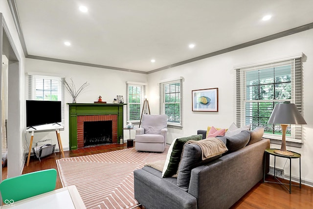 1725 W 53rd St, Indianapolis, IN 46228 - living room with ornamental molding, wood finished floors, healthy amount of natural light, baseboards, and a brick fireplace