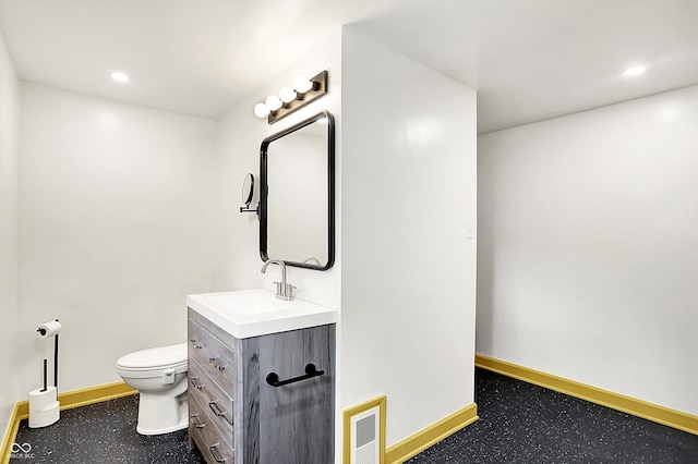 1725 W 53rd St, Indianapolis, IN 46228 - bathroom with baseboards, vanity, toilet, and recessed lighting