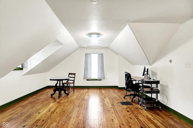 1725 W 53rd St, Indianapolis, IN 46228 - home office with hardwood / wood-style floors, baseboards, and lofted ceiling