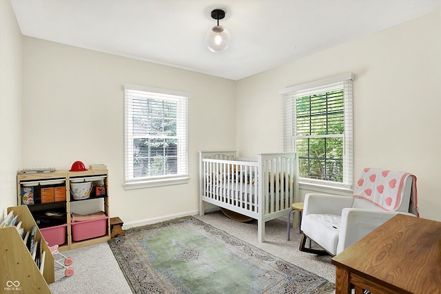 1725 W 53rd St, Indianapolis, IN 46228 - carpeted bedroom featuring multiple windows and baseboards