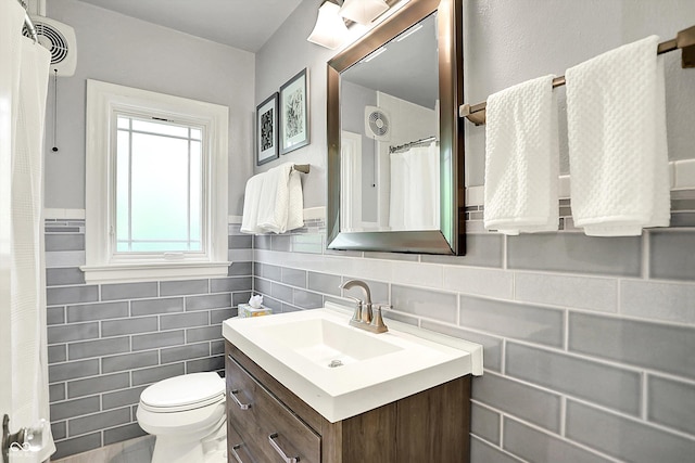 1725 W 53rd St, Indianapolis, IN 46228 - bathroom featuring vanity, toilet, tile walls, a wall unit AC, and curtained shower