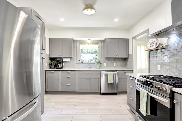 1725 W 53rd St, Indianapolis, IN 46228 - kitchen with stainless steel appliances, gray cabinetry, a sink, and light countertops