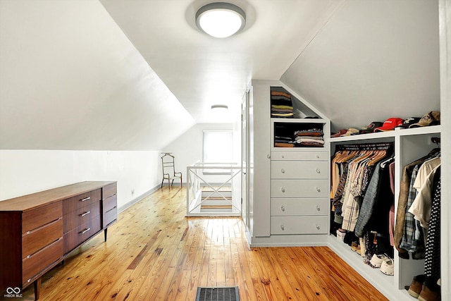 1725 W 53rd St, Indianapolis, IN 46228 - spacious closet with light wood-style floors and vaulted ceiling