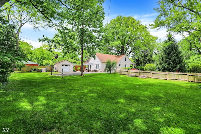 1725 W 53rd St, Indianapolis, IN 46228 - view of yard with an outbuilding, a garage, and view of wooded area
