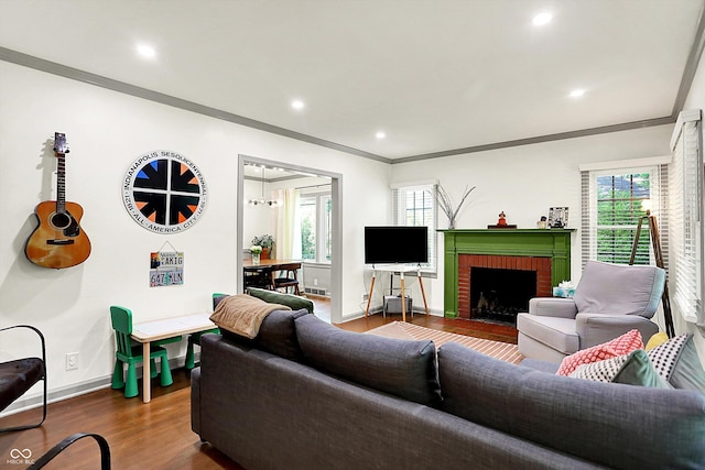 1725 W 53rd St, Indianapolis, IN 46228 - living area featuring ornamental molding, baseboards, dark wood-style flooring, a fireplace, and recessed lighting