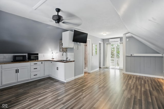 1240 Stringtown Pike, Cicero, IN 46034 - kitchen with a sink, black microwave, open floor plan, dark wood finished floors, and lofted ceiling