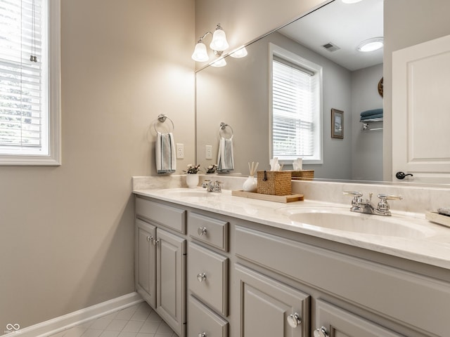 13069 Abraham Run, Carmel, IN 46033 - full bathroom featuring double vanity, tile patterned floors, and baseboards
