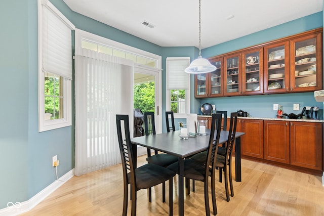 11510 Monon Farms Ln, Carmel, IN 46032 - dining room featuring light wood-style flooring, plenty of natural light, and baseboards