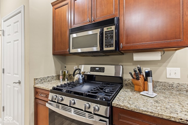 11510 Monon Farms Ln, Carmel, IN 46032 - kitchen with appliances with stainless steel finishes and light stone counters