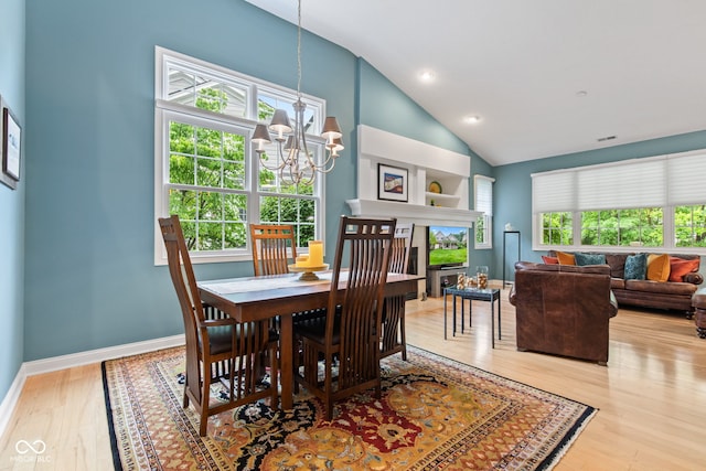 11510 Monon Farms Ln, Carmel, IN 46032 - dining area with a chandelier, lofted ceiling, wood finished floors, baseboards, and recessed lighting