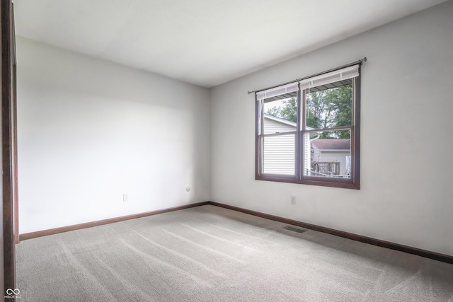 1367 Brookside Ct, Columbus, IN 47201 - carpeted spare room with baseboards