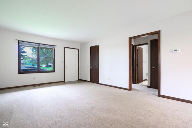 1367 Brookside Ct, Columbus, IN 47201 - unfurnished bedroom with light colored carpet and baseboards