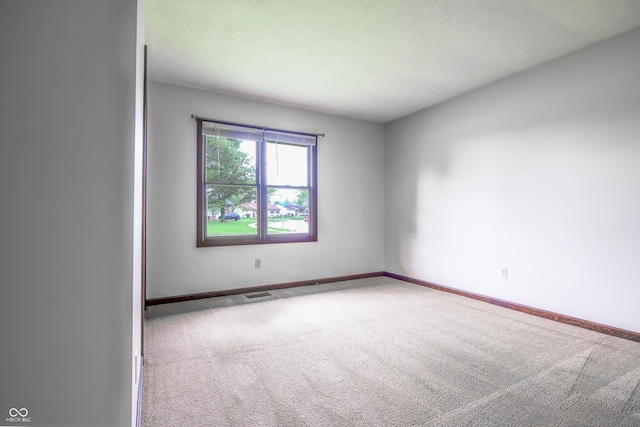 1367 Brookside Ct, Columbus, IN 47201 - carpeted spare room featuring baseboards