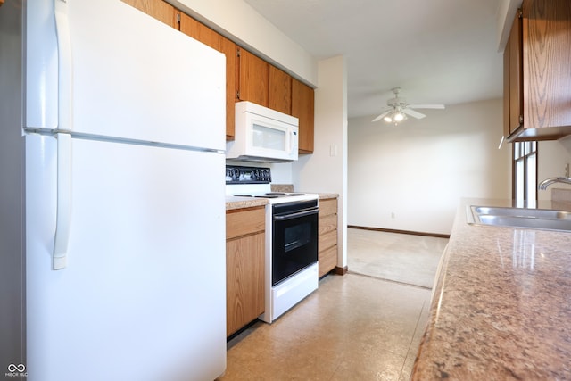 1367 Brookside Ct, Columbus, IN 47201 - kitchen with white appliances, a sink, ceiling fan, light countertops, and light floors