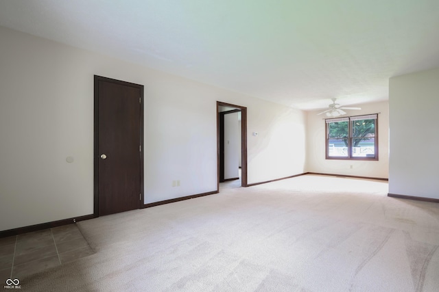 1367 Brookside Ct, Columbus, IN 47201 - empty room featuring light carpet, a ceiling fan, and baseboards