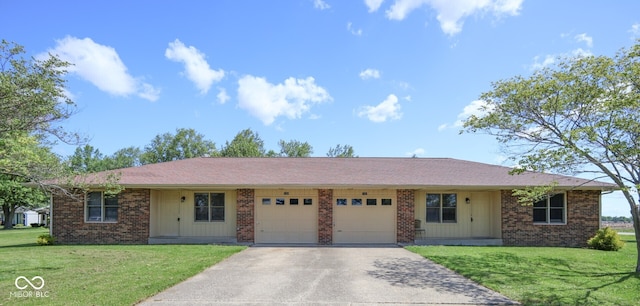 1367 Brookside Ct, Columbus, IN 47201 - ranch-style house featuring an attached garage, concrete driveway, brick siding, and a front yard