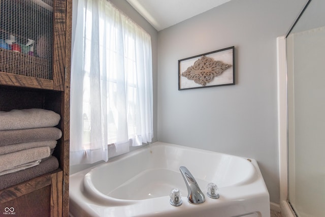 977 Canary Creek Dr, Franklin, IN 46131 - bathroom featuring a garden tub and a shower with door