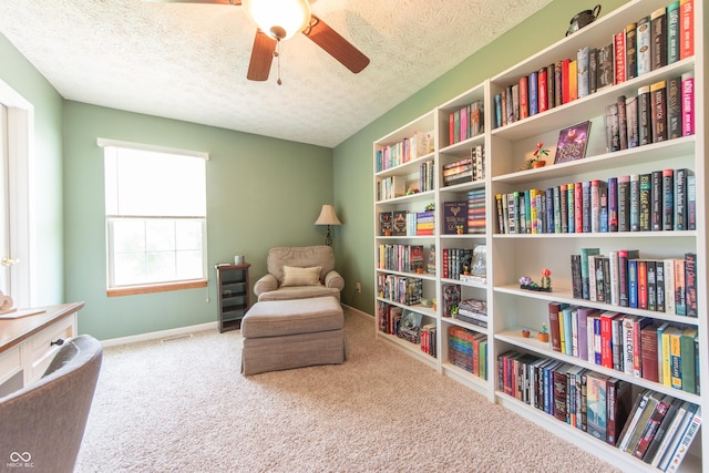 977 Canary Creek Dr, Franklin, IN 46131 - living area featuring carpet, a textured ceiling, and a ceiling fan