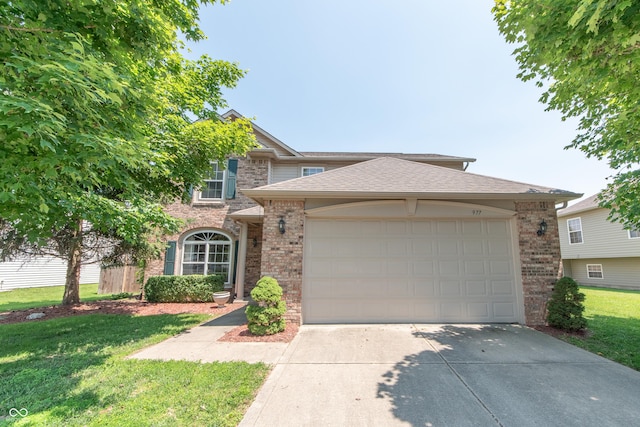 977 Canary Creek Dr, Franklin, IN 46131 - view of front of home with brick siding, driveway, a garage, a front yard, and roof with shingles
