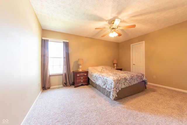 977 Canary Creek Dr, Franklin, IN 46131 - bedroom with light colored carpet, a textured ceiling, and a ceiling fan