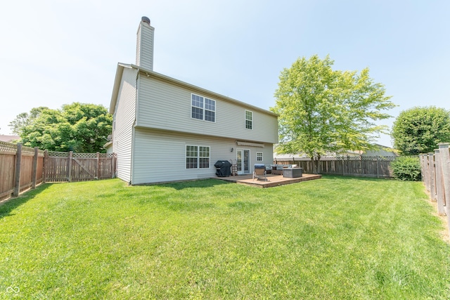 977 Canary Creek Dr, Franklin, IN 46131 - rear view of house featuring french doors, a fenced backyard, a deck, outdoor lounge area, and a chimney