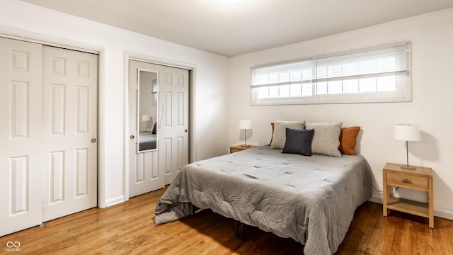 5002 E Washington St, Indianapolis, IN 46201 - bedroom with light wood-type flooring and baseboards