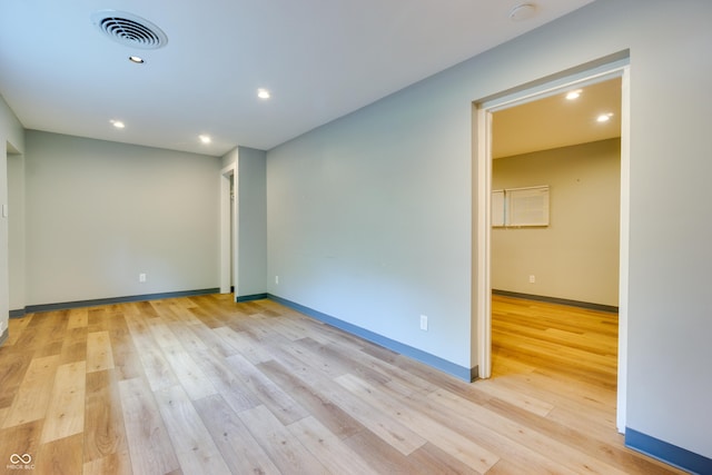 5002 E Washington St, Indianapolis, IN 46201 - spare room featuring light wood finished floors, recessed lighting, and a smoke detector