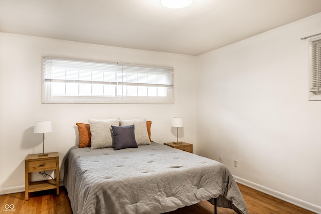 5002 E Washington St, Indianapolis, IN 46201 - bedroom with baseboards and wood finished floors