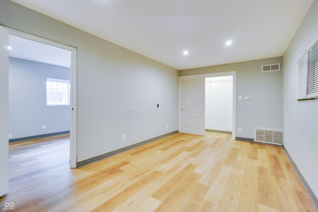 5002 E Washington St, Indianapolis, IN 46201 - spare room featuring light wood-style flooring and recessed lighting