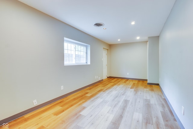 5002 E Washington St, Indianapolis, IN 46201 - empty room with light wood-style floors and recessed lighting