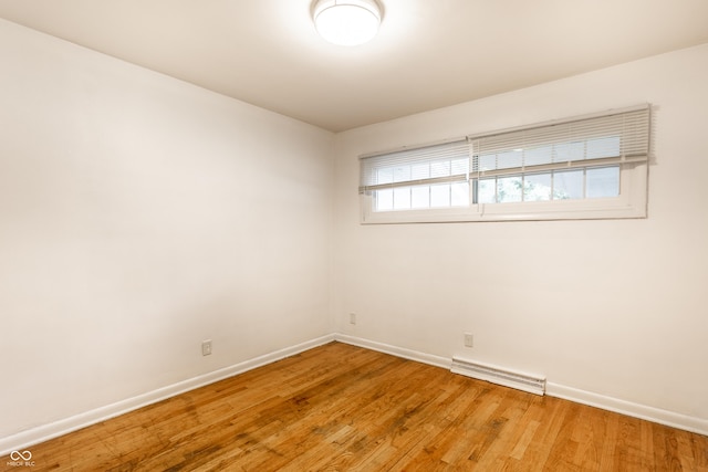 5002 E Washington St, Indianapolis, IN 46201 - spare room featuring baseboards and light wood-style flooring