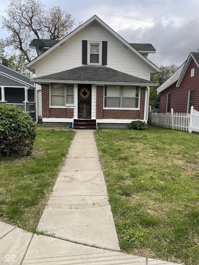 1021 W 37th St, Indianapolis, IN 46208 - bungalow-style house with brick siding and a shingled roof