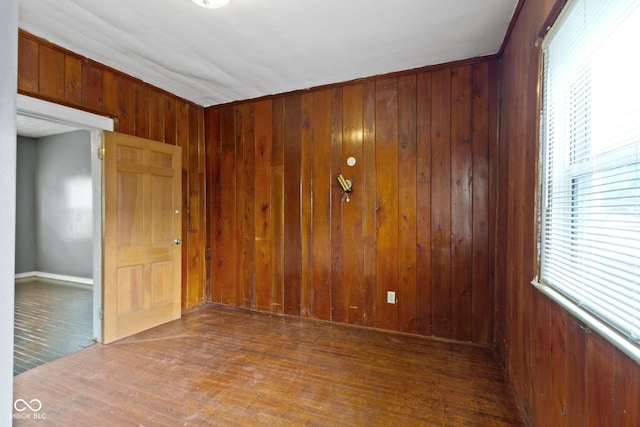 1021 W 37th St, Indianapolis, IN 46208 - spare room featuring wooden walls and wood finished floors