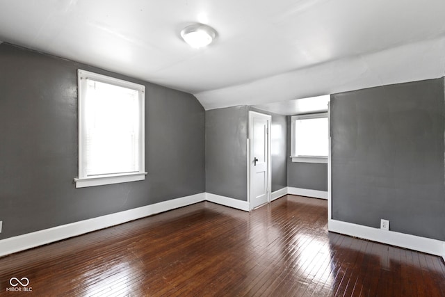 1021 W 37th St, Indianapolis, IN 46208 - bonus room with vaulted ceiling, wood-type flooring, and baseboards